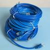 A coiled blue Cat6 Ethernet patch cable with connectors visible.
