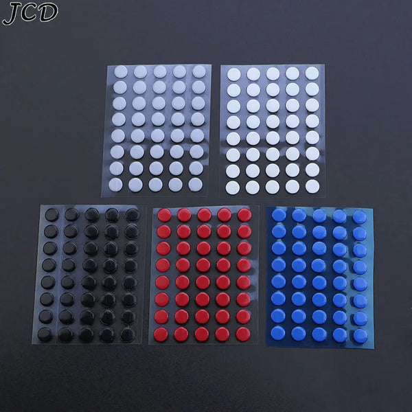 Four packs of universal mouse skates in white, black, red, and blue for adhesive gliding feet