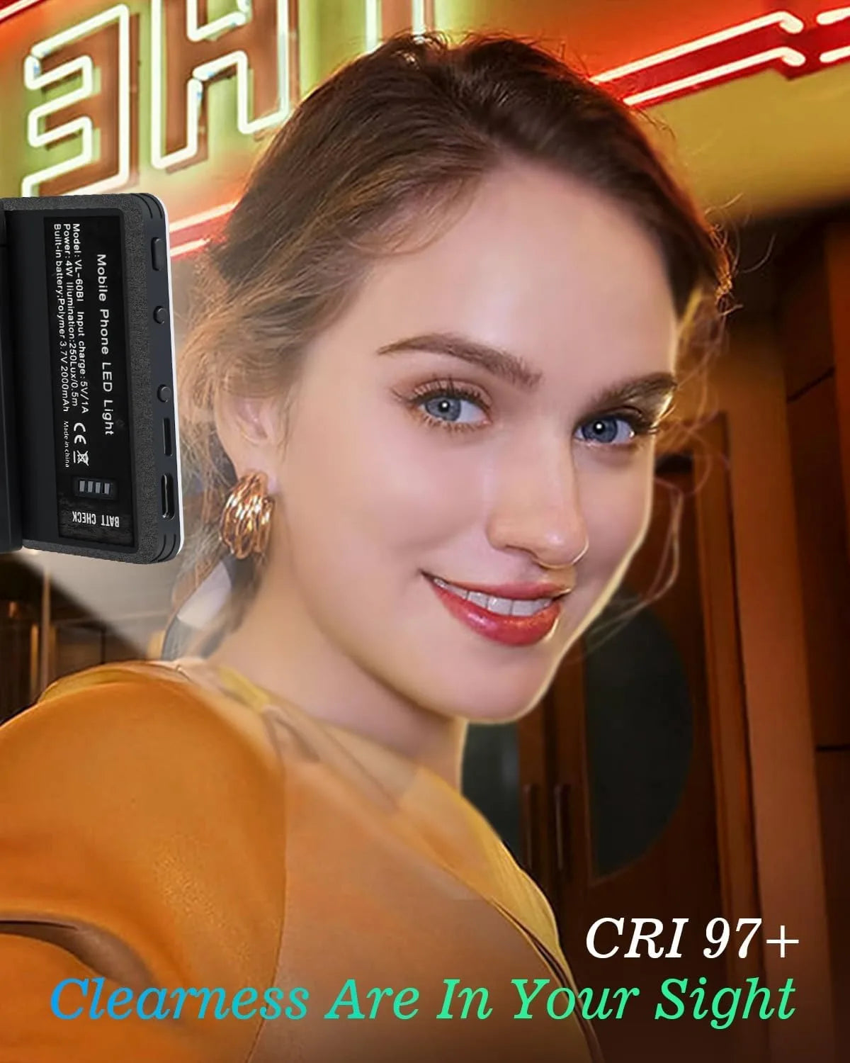 A young woman holds a portable clip-on LED selfie light, showcasing its features.