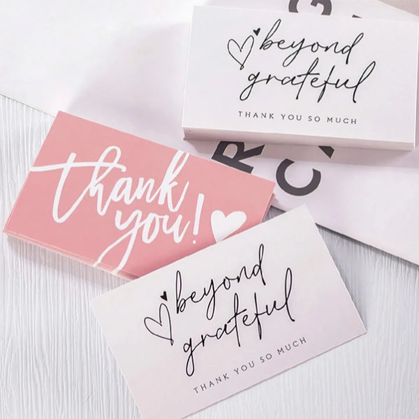 Pink and white thank you cards with handwritten text saying beyond grateful and thank you so much