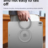 A person holds a silver magnetic tablet holder with an Apple logo on the screen, demonstrating its strong grip.