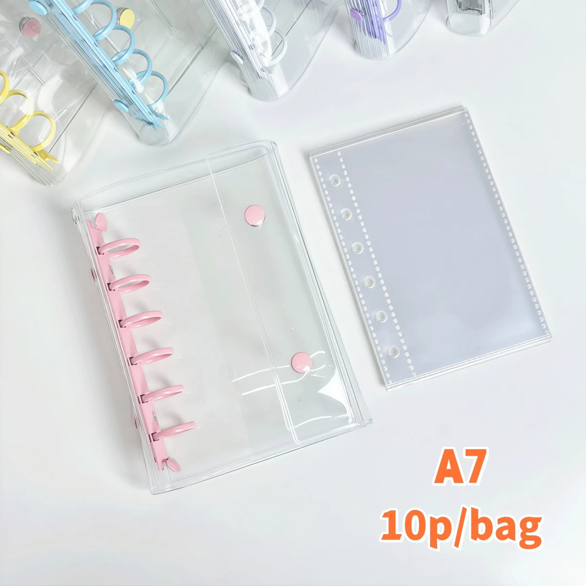 A clear double-button binder for stickers and journaling with pink and yellow accents shown on a white surface.