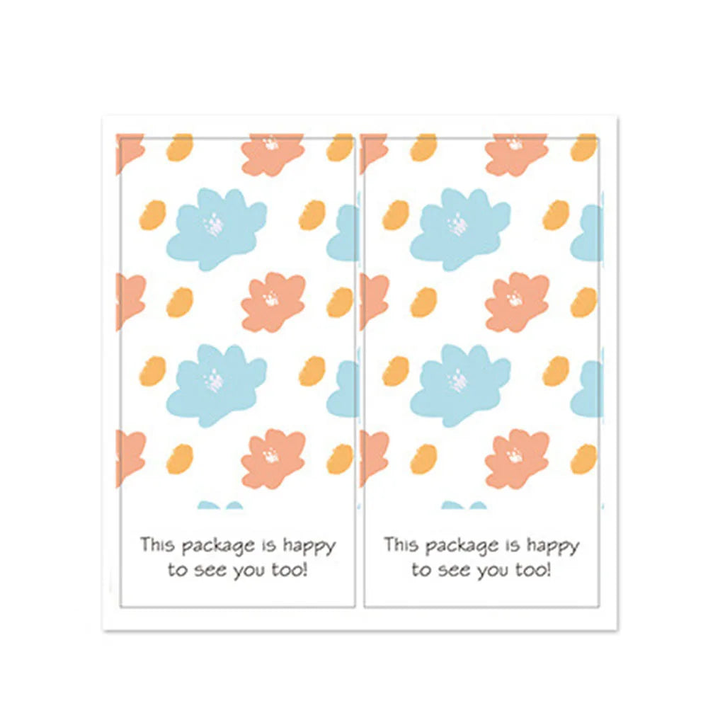 A pair of rectangular thank you gift stickers featuring light blue and peach floral patterns on white backgrounds.