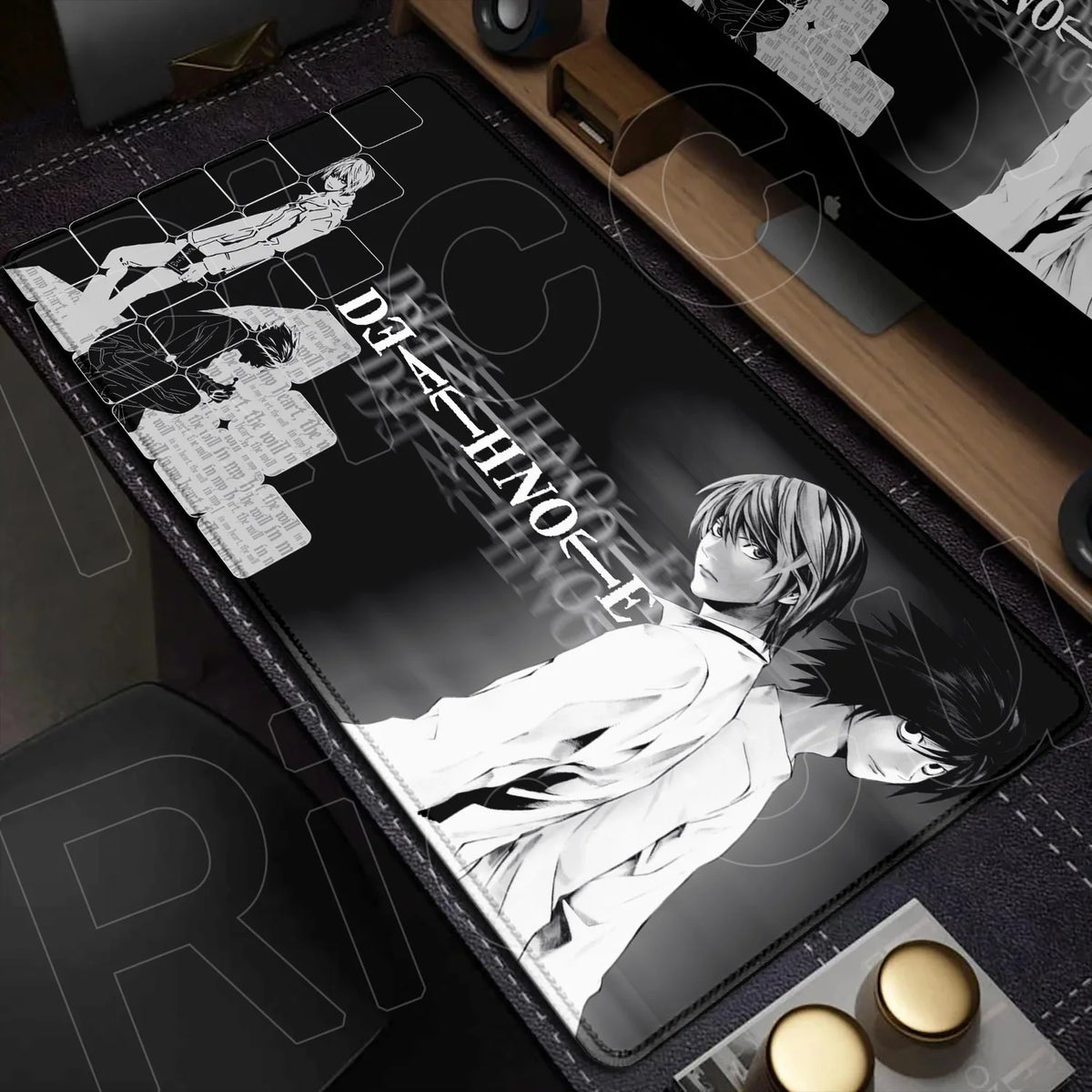 A black mouse pad featuring a monochrome illustration of a character from Death Note, displayed on a wooden desk.