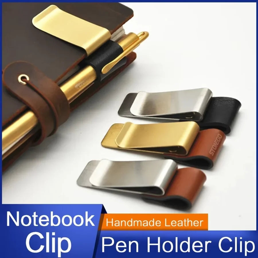 A handmade leather and brass clip used as a notebook or journal pen holder.