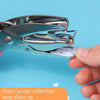 A hand holding a silver metal puncher used to create paper scraps for a collection.