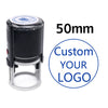 A black self-inking stamp with a silver base and a circular logo design, labeled 50mm.