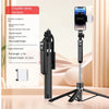 A black 360 degree rotation selfie stick with a smartphone attached, shown next to its packaging.
