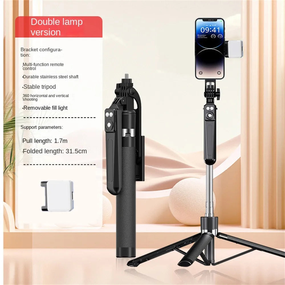 A black 360 degree rotation selfie stick with a smartphone attached, shown next to its packaging.