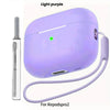 A purple liquid silicone case for AirPods Pro 2 shown with a cleaning pen and lanyard.
