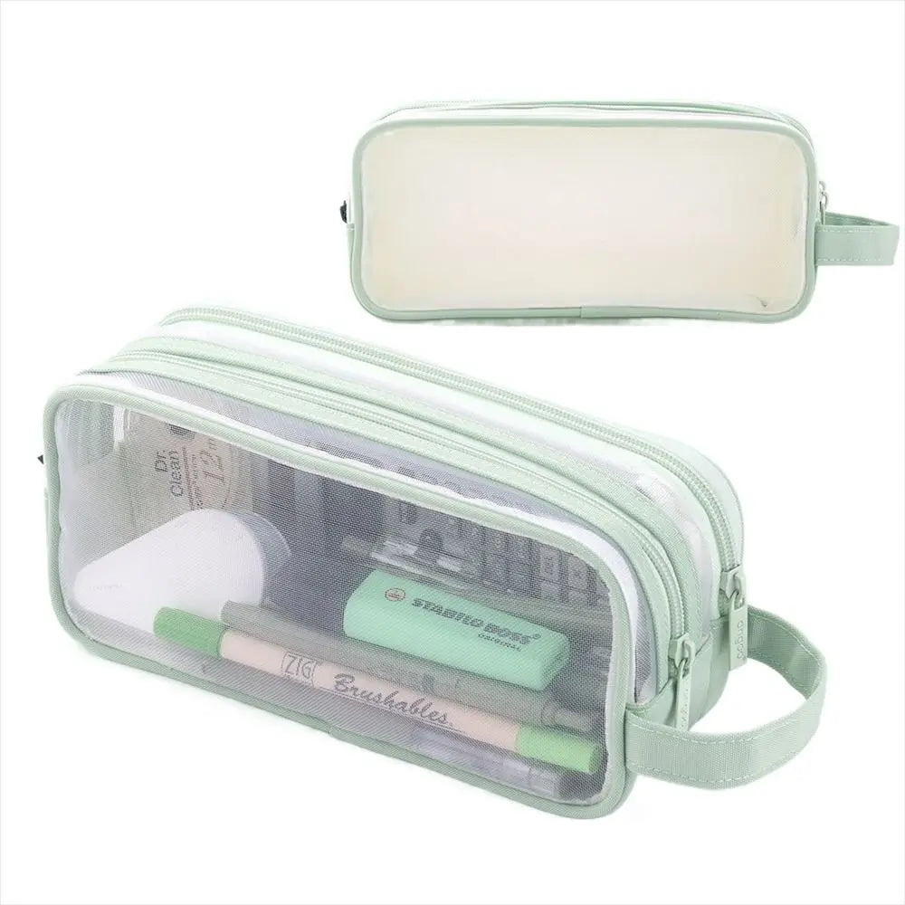 A clear plastic pencil case with a light green strap and interior compartments for pencils and brushables.