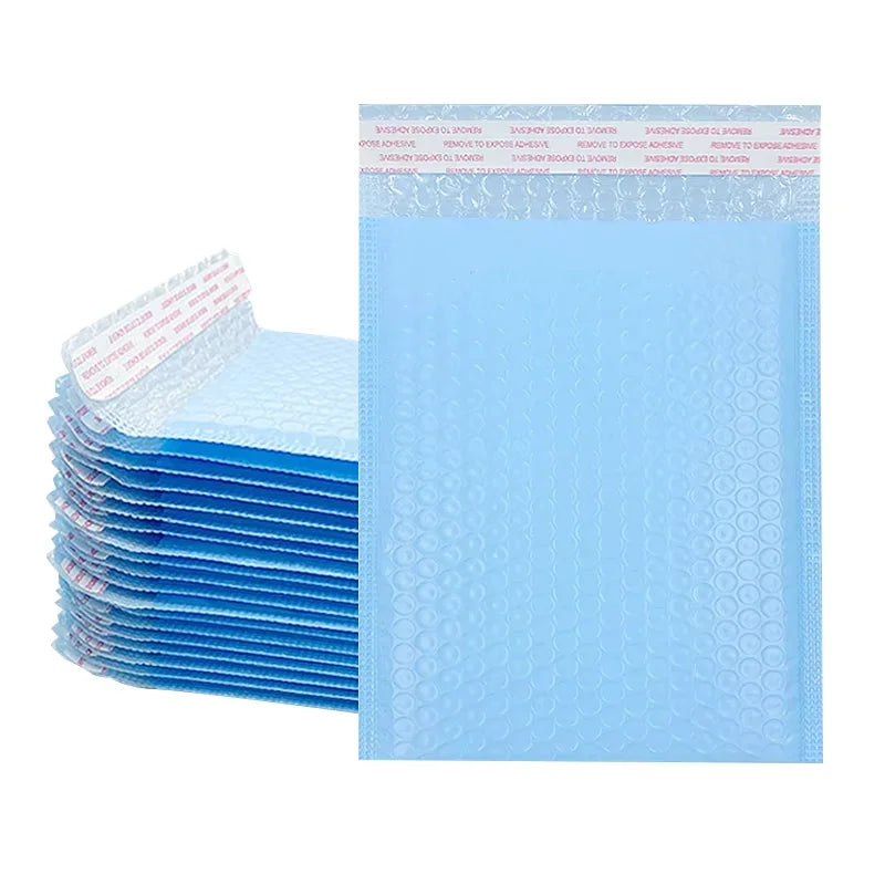 A stack of pink bubble mailers with self-sealing padded envelopes is shown next to a single blue envelope.
