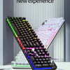 A close-up view of a black low profile wired gaming keyboard with a numeric keypad, displayed on a white surface.