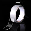 Roll of heavy duty clear double-sided gap tape with a dispenser applicator