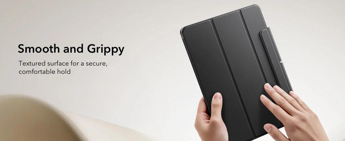 A hand holds a black magnetic folio case, demonstrating its smooth and grippy textured surface.