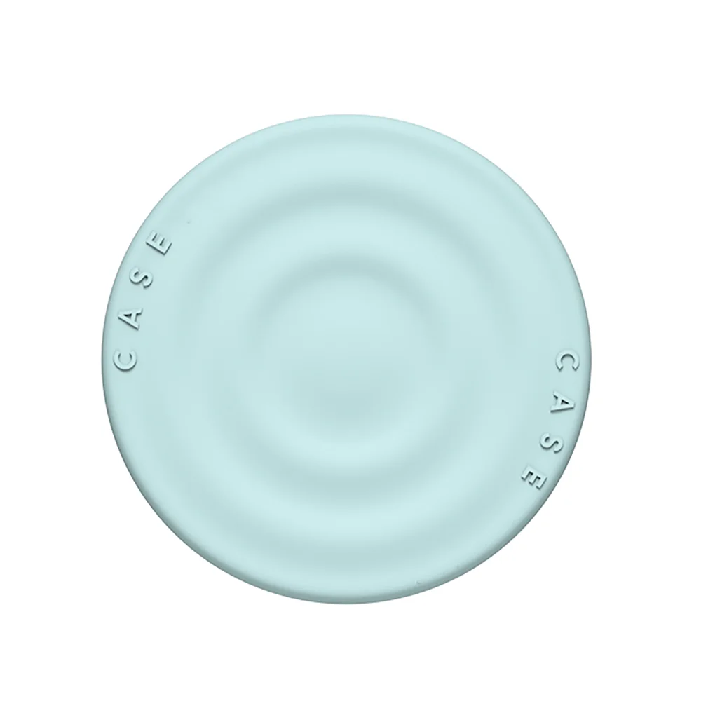 A light blue silicone ripple grip magnetic phone stand with a smooth, circular design.