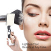 A woman's face is illuminated by a portable clip-on LED light, highlighting her skin and makeup.