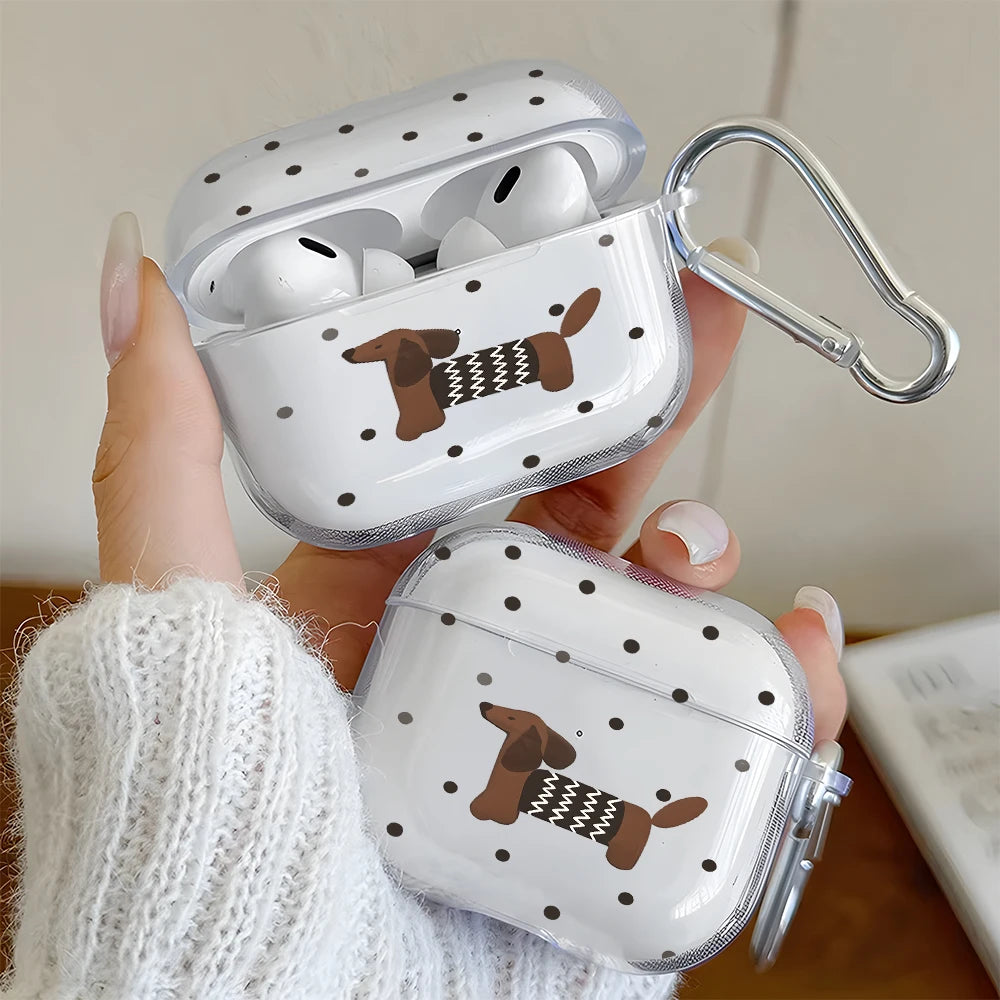 A hand holds a clear polka dot case for AirPods featuring a dachshund design.