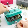 A hand opens a teal steel cash box with a key lock and removable tray, showing stacked coins.