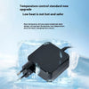 A black laptop charger adapter is shown resting on a block of ice.