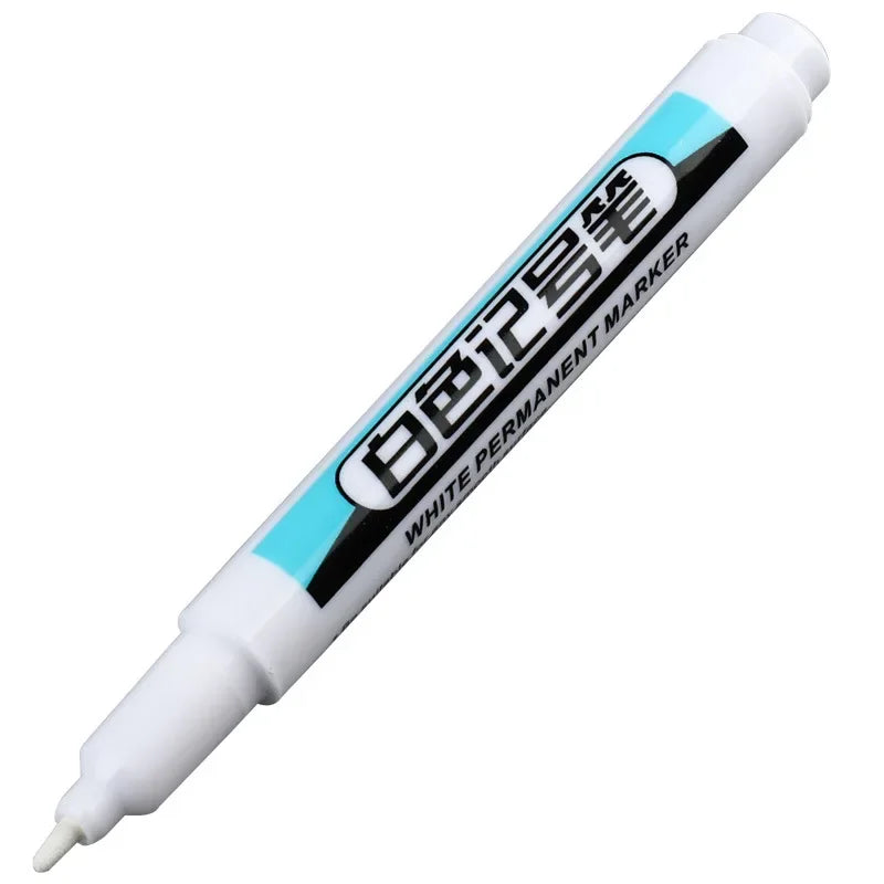 A white permanent paint marker pen with black text and a light blue accent band.