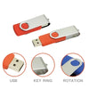 A silver and orange metal USB flash drive with a key ring attachment and a rotation feature.