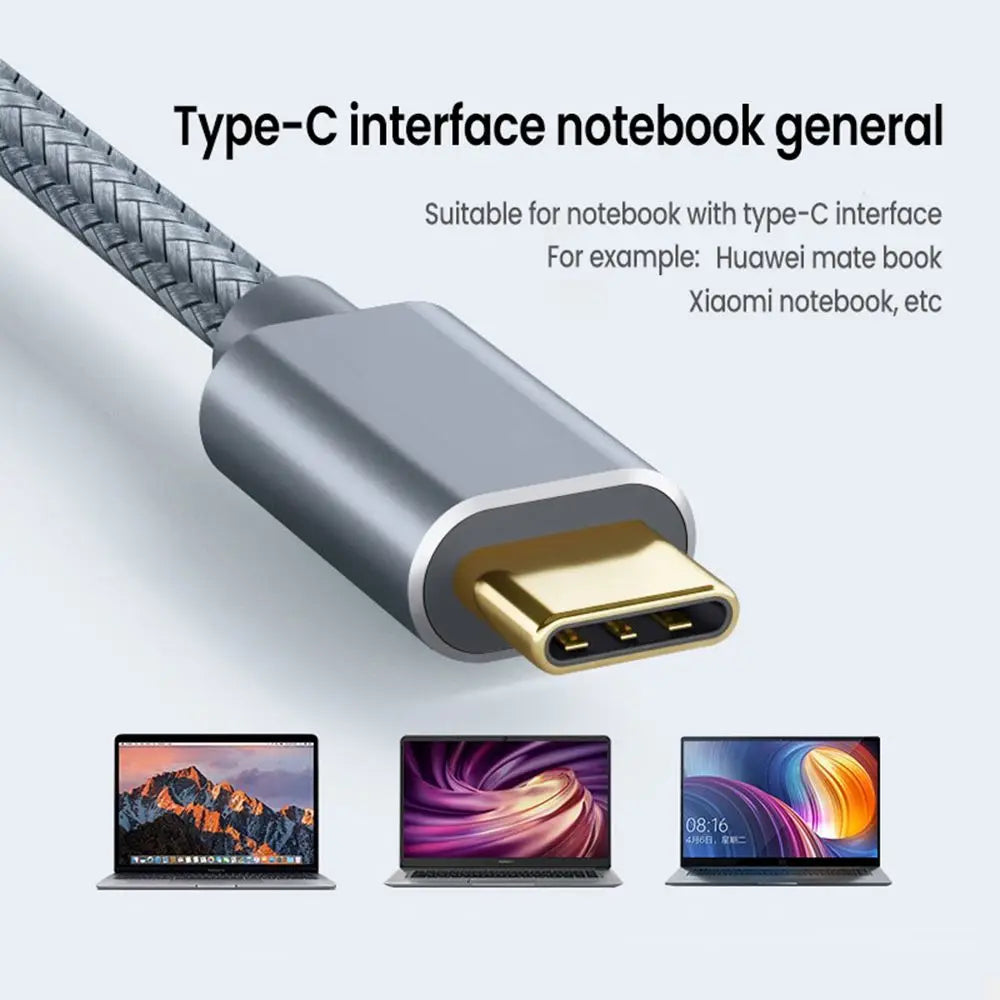 A silver Type-C interface cable with a gold connector is shown next to several laptops.