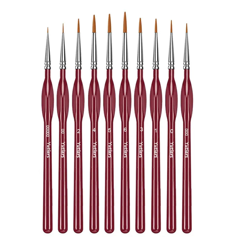 A set of professional miniature paint brushes with ergonomic handles, shown standing upright.