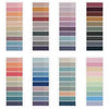 A collection of various pastel, earth tone, and muted color sticky notes in a vertical arrangement.