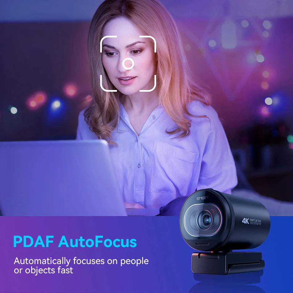 A woman is using a laptop and a 4K HD streaming webcam with autofocus to focus on objects.