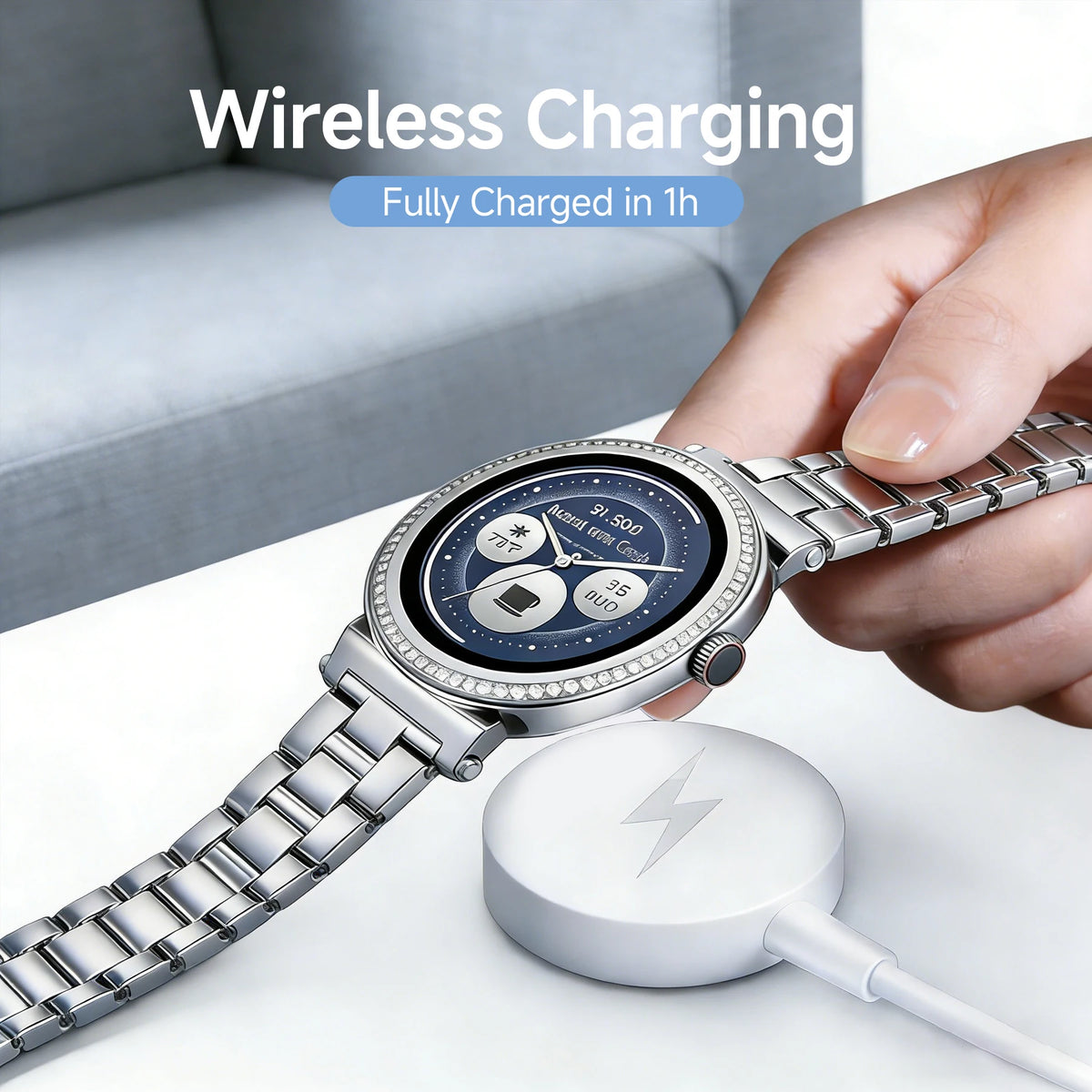 A hand holds a silver Michael Kors smartwatch near a white wireless charging pad.