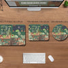 Three sizes of Kawaii Frog desk mats featuring a lush green garden theme displayed on a wooden desk.