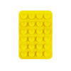 A yellow silicone suction cup mount with 24 individual cups for phone and tablet mounting.