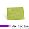 A green cutting mat with a grid for guides, labeled Junesix, measuring A6 size.
