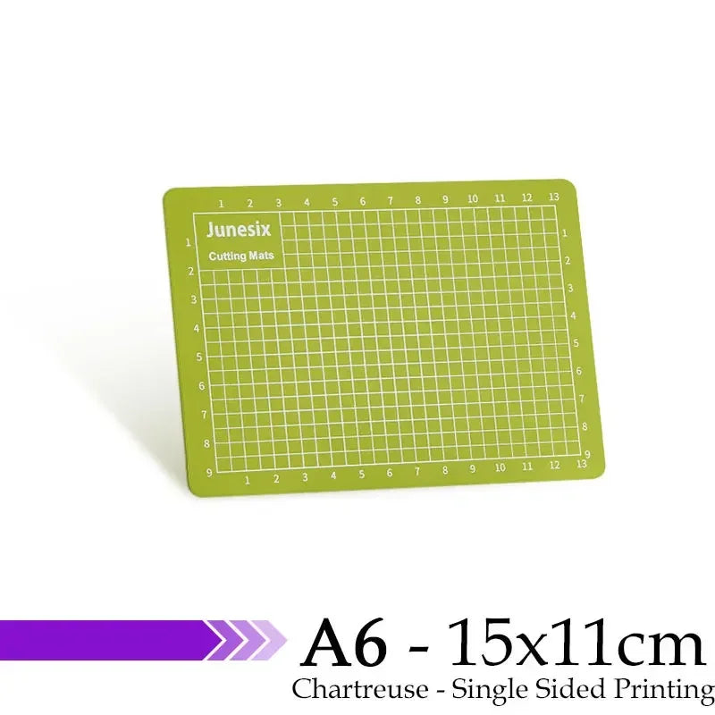 A green cutting mat with a grid for guides, labeled Junesix, measuring A6 size.