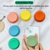 A hand holds a phone with a silicone grip cover, showing various colored silicone grips for a comfortable hold.