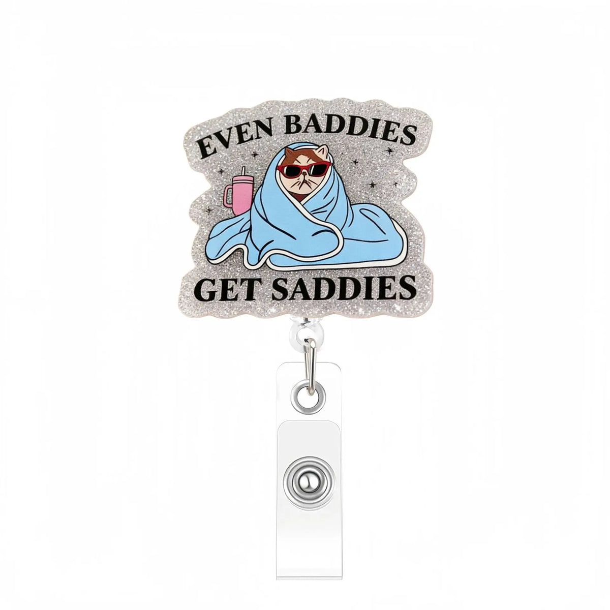 A silver acrylic nurse badge reel featuring text that reads Even Buddies Get Saddies and an illustration of a person wrapped 