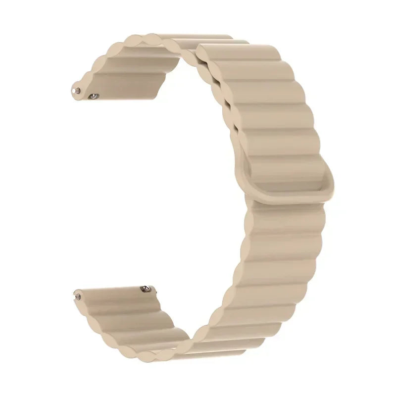 A beige adjustable magnetic loop watch band shown in a curved shape.