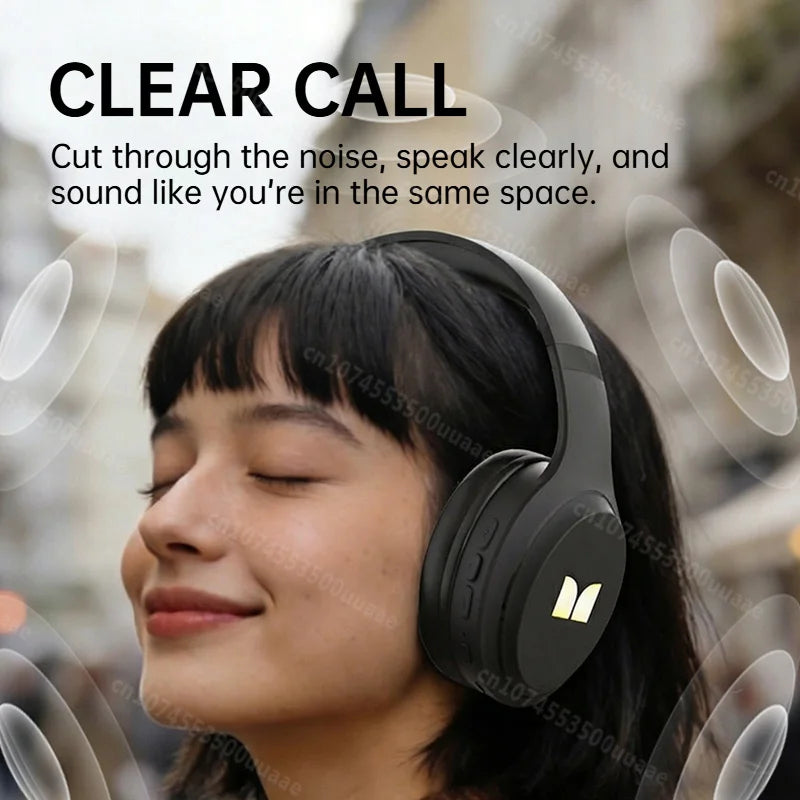 A woman is wearing black over-ear headphones, demonstrating clear sound quality.