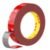 Roll of red heavy duty acrylic foam double sided tape with yellow markings and a gray applicator tool