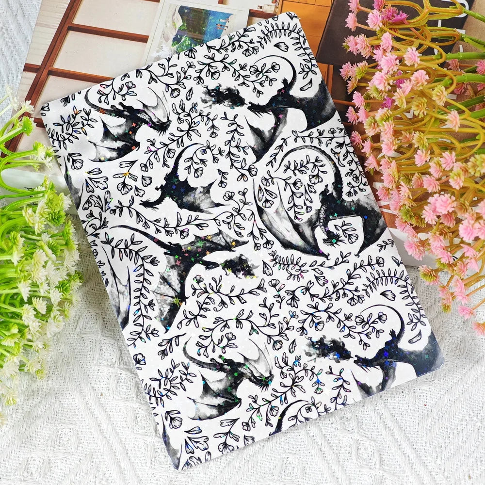 Stapel niedlicher, karikierter Dekorationskarten für Kindle und Tablet mit schwarz-weißen Blumenmotiven.