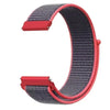 A close-up view of a red and gray nylon loop watch strap for kids.