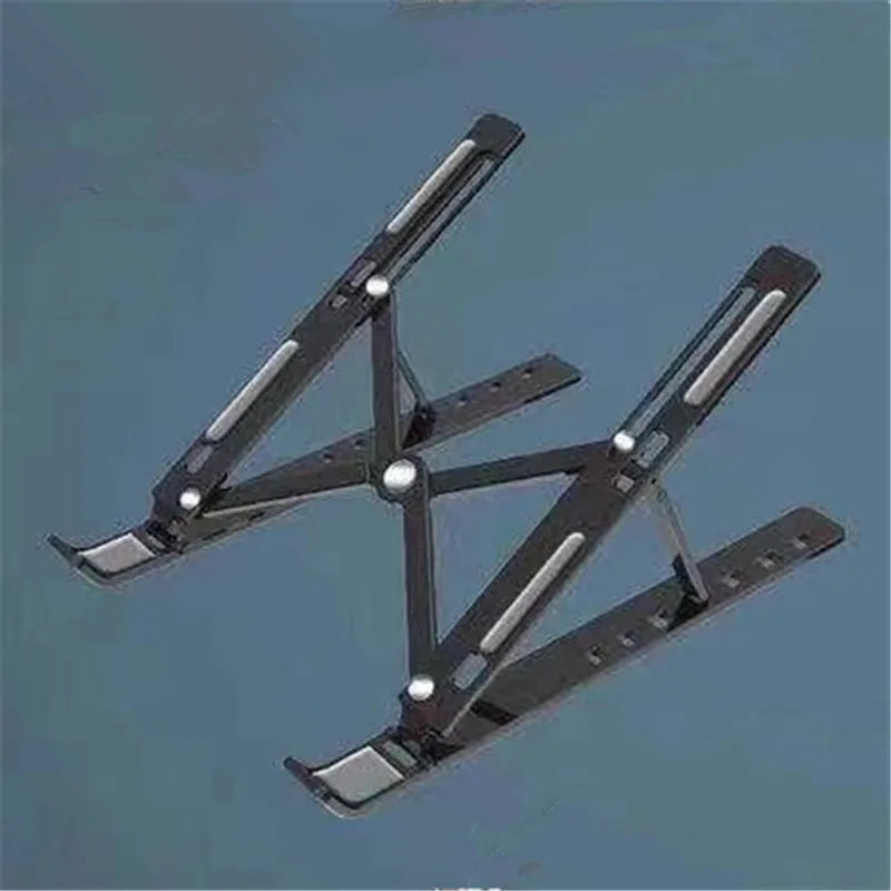 A foldable adjustable laptop stand made of metal, shown in a diagonal angle against a gray background.