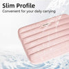 A pink padded laptop sleeve is shown being washed under running water.