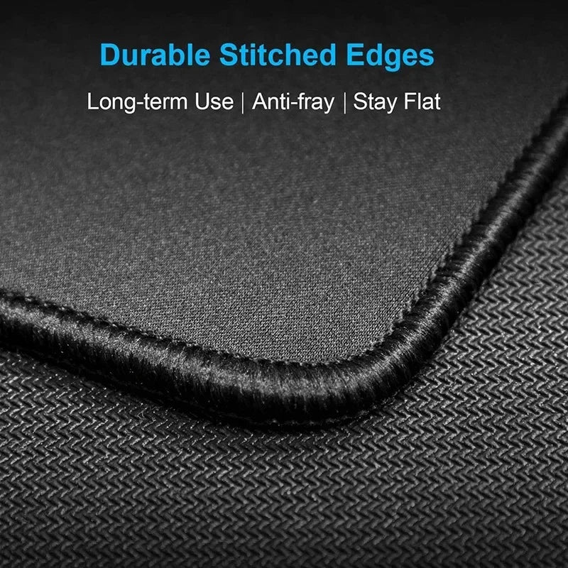 Black stitched edge of a trash panda playmat for card games and desk use