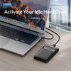 A silver laptop is shown with a hard drive enclosure plugged into a USB cable, demonstrating the activation of an idle hard d