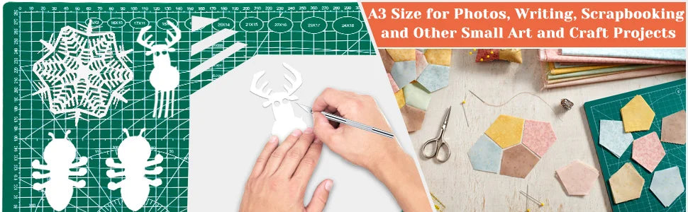 A cutting mat with various craft materials and tools, showing a hand cutting an antler shape.