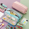 A pink pencil pouch is shown open, filled with various colored pencils and art supplies on a green background.