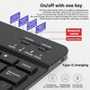 A black portable Bluetooth keyboard and mouse set with various indicator lights and a Type-C charging port.