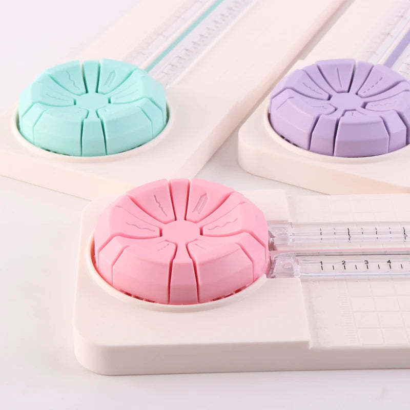 A set of four colored rotary paper cutting dies and a measuring guide for a 4-in-1 rotary paper cutting machine.